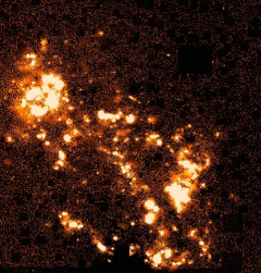 In this rendition the red image has been subtracted from the H-alpha image which mostly cancels the contributions from normal stars and is effective in highlighting just the areas of active star formation. For clarity uncancelled stellar residuals have been removed